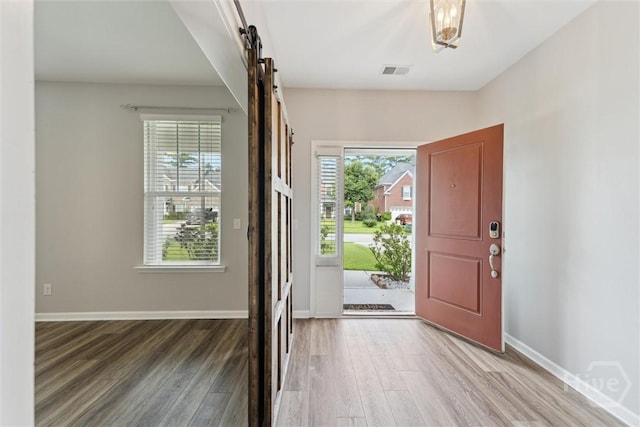 54 Winslow, Savannah, GA 31407 - entrance foyer with a barn door and wood finished floors