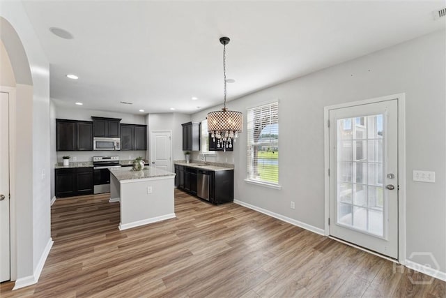 54 Winslow, Savannah, GA 31407 - kitchen with stainless steel appliances, light wood-type flooring, a center island, decorative light fixtures, and recessed lighting