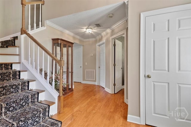114 Lakeview Ct, Savannah, GA 31406 - foyer entrance featuring ornamental molding, light wood-type flooring, and stairs