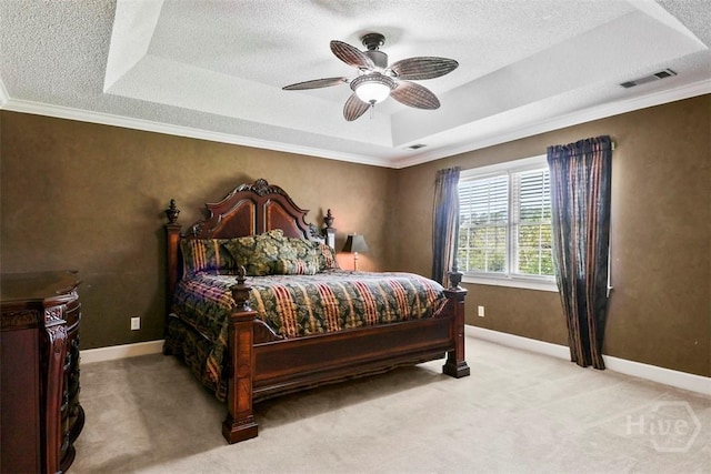 114 Lakeview Ct, Savannah, GA 31406 - bedroom with a tray ceiling, light carpet, a textured ceiling, ornamental molding, and a ceiling fan