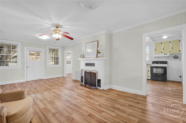 345 Magnolia St, Richmond Hill, GA 31324 - unfurnished living room with a ceiling fan, light wood finished floors, a fireplace, crown molding, and attic access