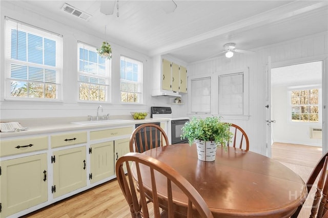 345 Magnolia St, Richmond Hill, GA 31324 - dining space with a ceiling fan, light wood-type flooring, and beam ceiling