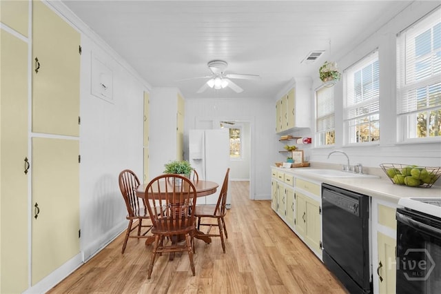 345 Magnolia St, Richmond Hill, GA 31324 - kitchen featuring light wood-style flooring, white refrigerator with ice dispenser, light countertops, and dishwasher