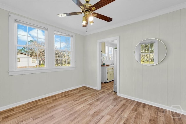 345 Magnolia St, Richmond Hill, GA 31324 - unfurnished room featuring light wood-style floors, ornamental molding, and a ceiling fan