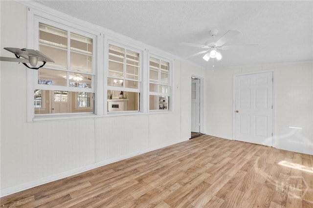 345 Magnolia St, Richmond Hill, GA 31324 - unfurnished room with wood finished floors, ceiling fan, and a textured ceiling