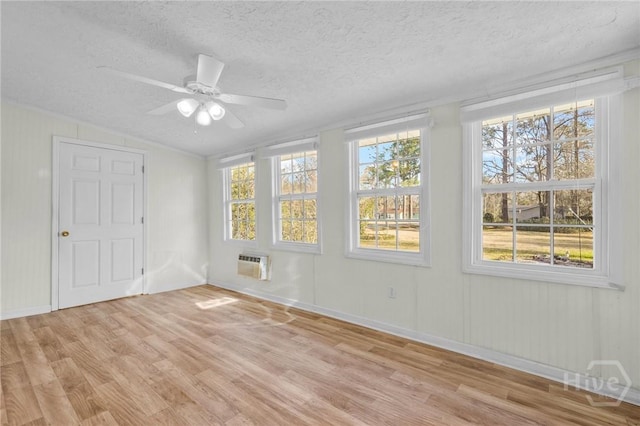 345 Magnolia St, Richmond Hill, GA 31324 - unfurnished bedroom featuring light wood-style flooring, lofted ceiling, a textured ceiling, and ceiling fan