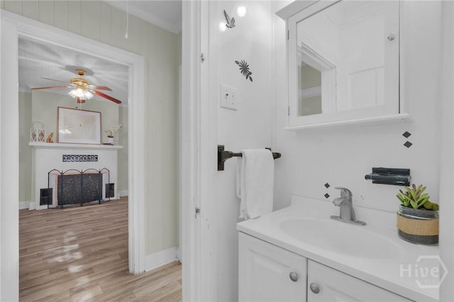 345 Magnolia St, Richmond Hill, GA 31324 - bathroom featuring ceiling fan, vanity, and wood finished floors