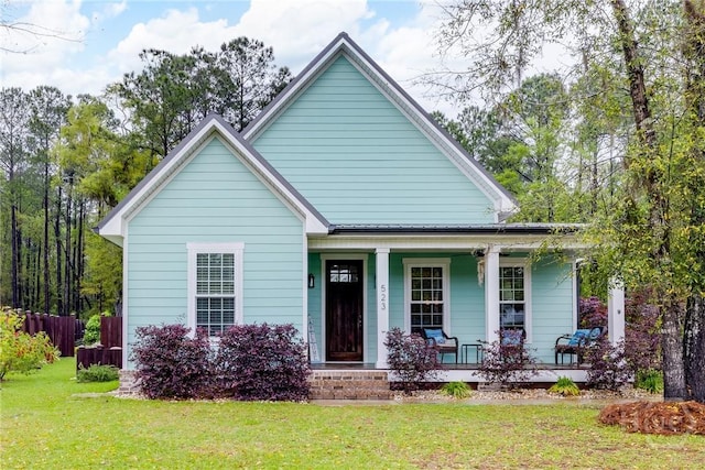 523 Goodman Dr, Midway, GA 31320 - bungalow-style house with a porch