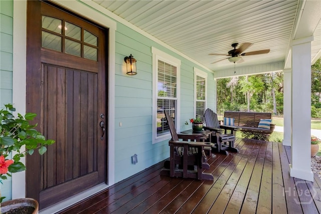 523 Goodman Dr, Midway, GA 31320 - wooden porch with a ceiling fan
