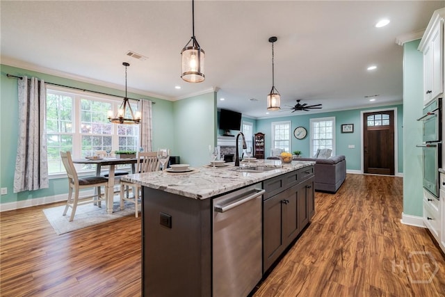 523 Goodman Dr, Midway, GA 31320 - kitchen with stainless steel appliances, wood finished floors, open floor plan, recessed lighting, and decorative light fixtures