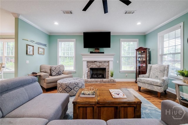523 Goodman Dr, Midway, GA 31320 - living room featuring ornamental molding, wood finished floors, plenty of natural light, a ceiling fan, and recessed lighting
