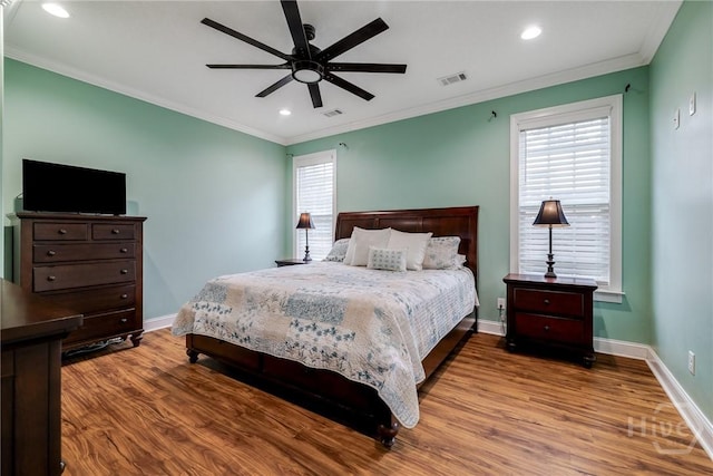 523 Goodman Dr, Midway, GA 31320 - bedroom featuring wood finished floors, crown molding, recessed lighting, and ceiling fan