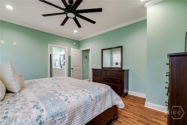 523 Goodman Dr, Midway, GA 31320 - bedroom with wood finished floors, ornamental molding, recessed lighting, ceiling fan, and ensuite bathroom