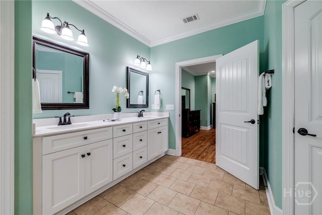 523 Goodman Dr, Midway, GA 31320 - bathroom with crown molding, double vanity, and tile patterned floors