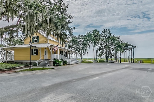 523 Goodman Dr, Midway, GA 31320 - view of asphalt road with street lights