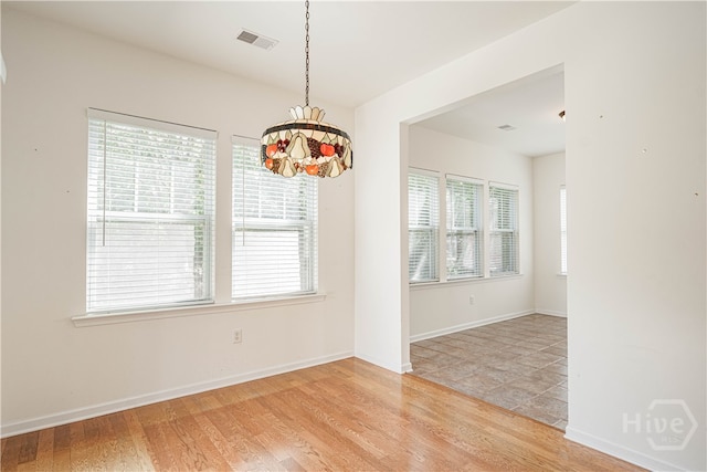 143 Regency Cir, Pooler, GA 31322 - empty room featuring a chandelier and light wood finished floors