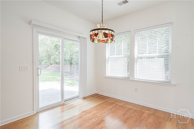 143 Regency Cir, Pooler, GA 31322 - empty room with light wood-type flooring and a chandelier