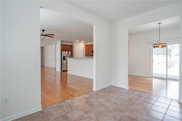 143 Regency Cir, Pooler, GA 31322 - spare room with ceiling fan and light stone finish flooring
