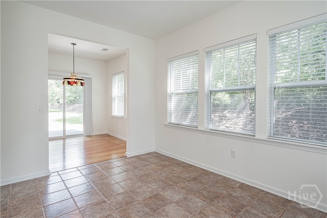 143 Regency Cir, Pooler, GA 31322 - spare room with baseboards and stone finish flooring