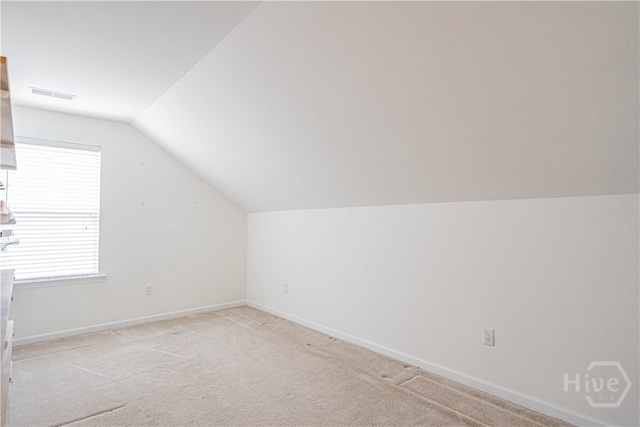 143 Regency Cir, Pooler, GA 31322 - additional living space with lofted ceiling, light colored carpet, and plenty of natural light