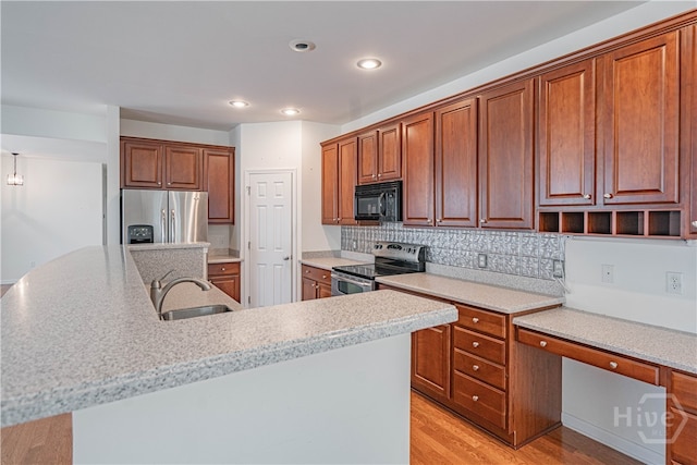 143 Regency Cir, Pooler, GA 31322 - kitchen featuring a kitchen island with sink, stainless steel appliances, light countertops, light wood finished floors, and recessed lighting