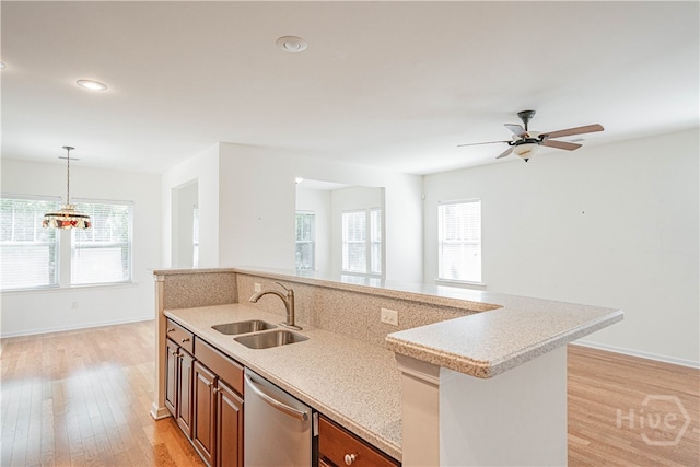 143 Regency Cir, Pooler, GA 31322 - kitchen featuring stainless steel dishwasher, light countertops, light wood finished floors, pendant lighting, and recessed lighting
