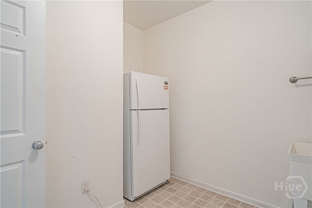 143 Regency Cir, Pooler, GA 31322 - kitchen featuring freestanding refrigerator and baseboards