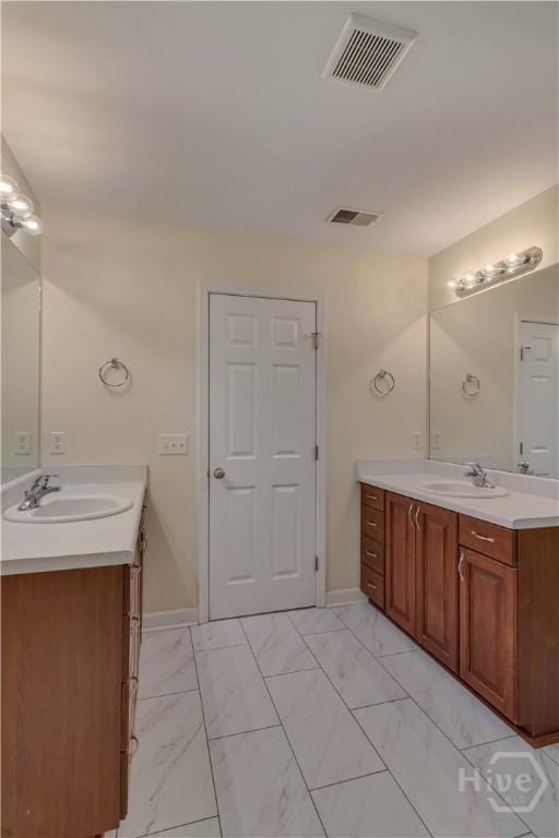 650 Summer Hill Way, Richmond Hill, GA 31324 - bathroom with two vanities and marble look tiles