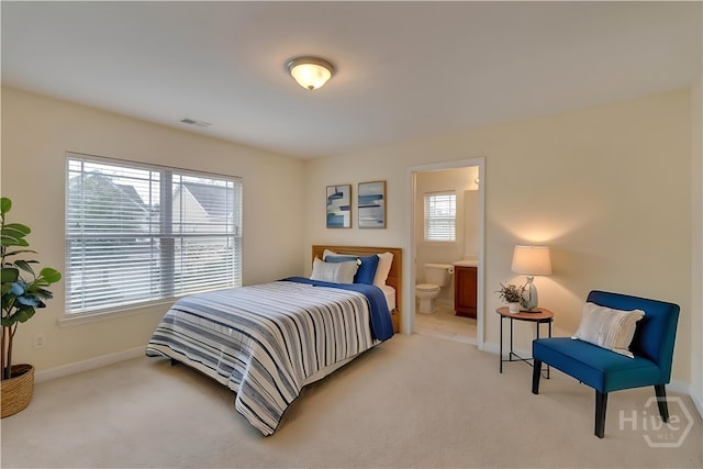 650 Summer Hill Way, Richmond Hill, GA 31324 - bedroom with light carpet and connected bathroom