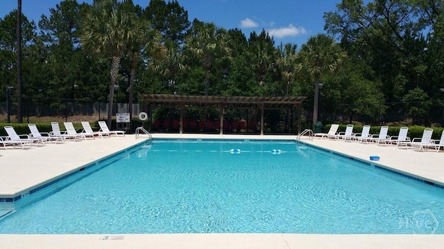 650 Summer Hill Way, Richmond Hill, GA 31324 - community pool with a patio and a pergola