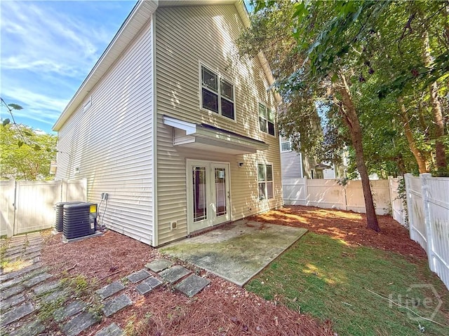 650 Summer Hill Way, Richmond Hill, GA 31324 - rear view of house featuring french doors, a fenced backyard, and a patio