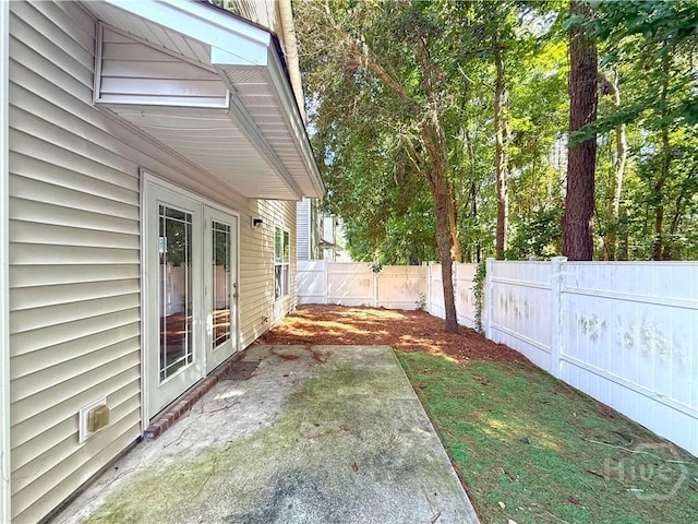 650 Summer Hill Way, Richmond Hill, GA 31324 - fenced backyard featuring a patio area and french doors