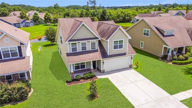 121 Belle Gate Dr, Pooler, GA 31322 - craftsman inspired home with stone siding, concrete driveway, a garage, a shingled roof, and a front lawn
