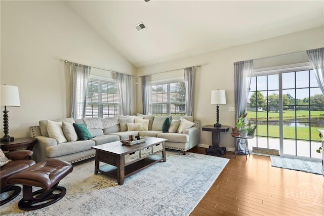 121 Belle Gate Dr, Pooler, GA 31322 - living area with high vaulted ceiling and wood-type flooring