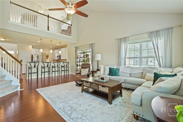 121 Belle Gate Dr, Pooler, GA 31322 - living area featuring a ceiling fan, dark wood-type flooring, high vaulted ceiling, and stairway