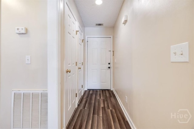 310 Tibet Ave Unit 52, Savannah, GA 31406 - corridor featuring dark wood-type flooring and a textured ceiling