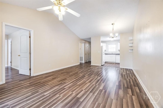 310 Tibet Ave Unit 52, Savannah, GA 31406 - unfurnished living room featuring a chandelier, dark wood finished floors, lofted ceiling, and a ceiling fan