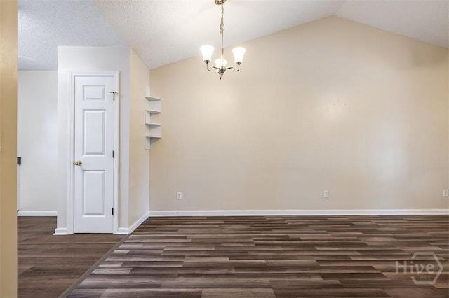 310 Tibet Ave Unit 52, Savannah, GA 31406 - unfurnished room with dark wood finished floors, lofted ceiling, and a chandelier