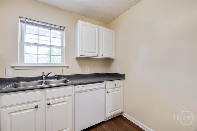 310 Tibet Ave Unit 52, Savannah, GA 31406 - kitchen with white dishwasher, dark countertops, dark wood finished floors, white cabinetry, and a textured ceiling