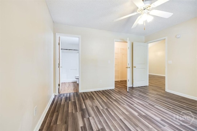 310 Tibet Ave Unit 52, Savannah, GA 31406 - unfurnished bedroom with wood finished floors, a textured ceiling, a spacious closet, ensuite bathroom, and ceiling fan