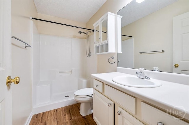 310 Tibet Ave Unit 52, Savannah, GA 31406 - bathroom with wood finished floors, a shower, vanity, and a textured ceiling