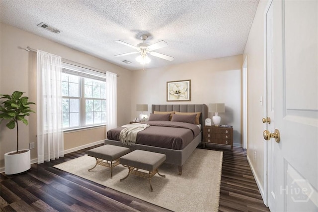310 Tibet Ave Unit 52, Savannah, GA 31406 - bedroom with a textured ceiling, dark wood-style flooring, and ceiling fan