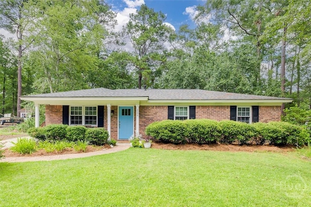 206 Pinecrest Pl, Pooler, GA 31322 - ranch-style home with brick siding, a front yard, and roof with shingles