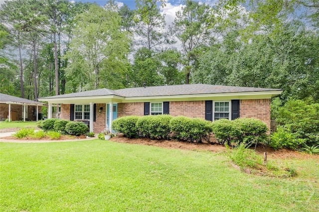 206 Pinecrest Pl, Pooler, GA 31322 - ranch-style house featuring a front lawn, brick siding, and view of scattered trees