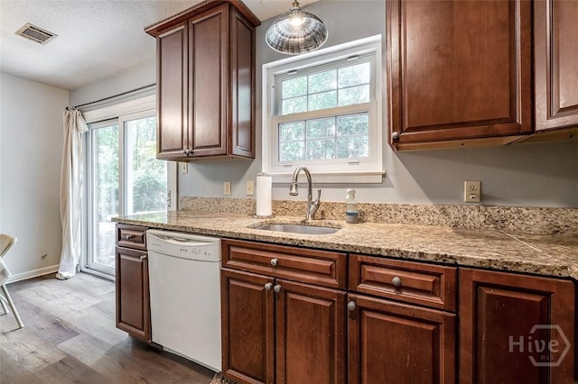 206 Pinecrest Pl, Pooler, GA 31322 - kitchen with white dishwasher, dark wood finished floors, plenty of natural light, and light stone countertops