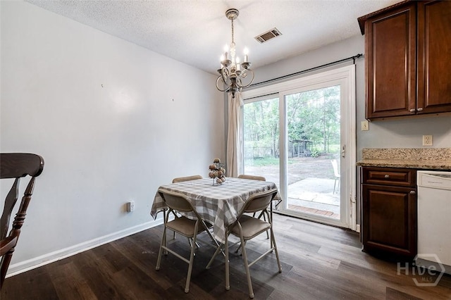 206 Pinecrest Pl, Pooler, GA 31322 - dining area featuring a chandelier, dark wood finished floors, and a textured ceiling