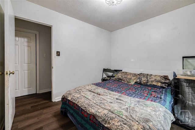 206 Pinecrest Pl, Pooler, GA 31322 - bedroom featuring dark wood finished floors and a textured ceiling