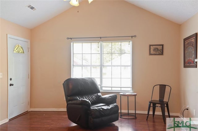 sitting room with lofted ceiling, ceiling fan, and dark hardwood / wood-style flooring