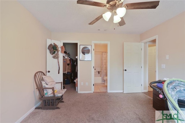 sitting room with light colored carpet and ceiling fan