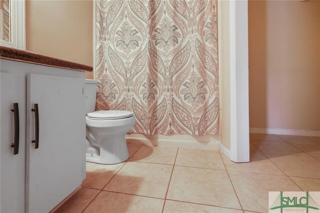 bathroom with tile floors and toilet